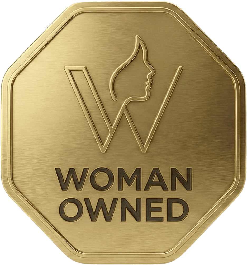A gold octagonal badge with a stylized "W" and a woman's profile above the words "WOMAN OWNED. - Skyhawks-Supertots Colorado